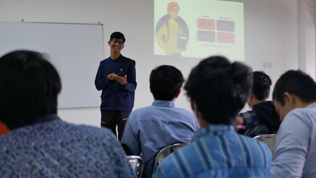 manlecturing in front of students